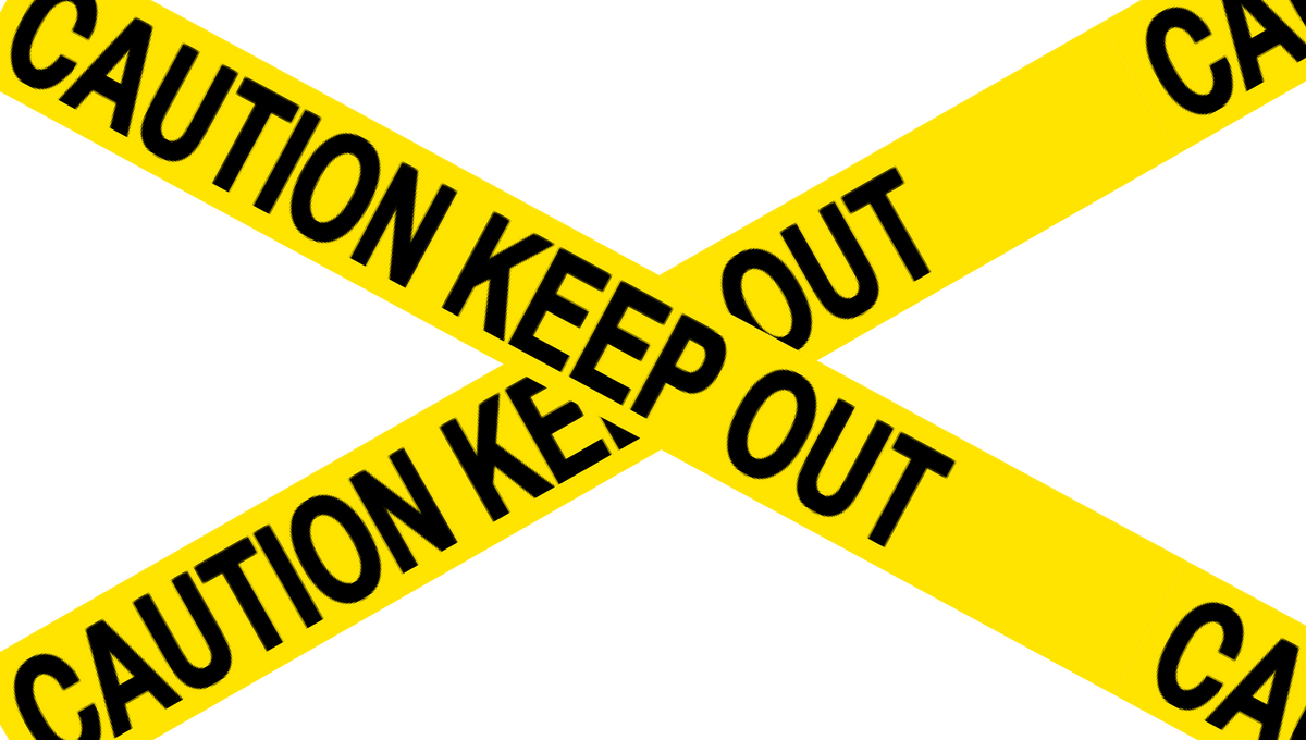 Assorted sections of yellow warning tape with words saying caution keep out